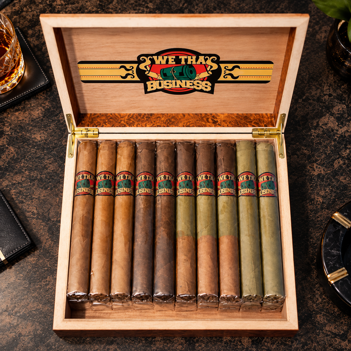 Top view of We Tha Business Boss 20-cigar sampler wooden box featuring Connecticut, Cameroon, Candela and Tri-Wrap Toro cigars